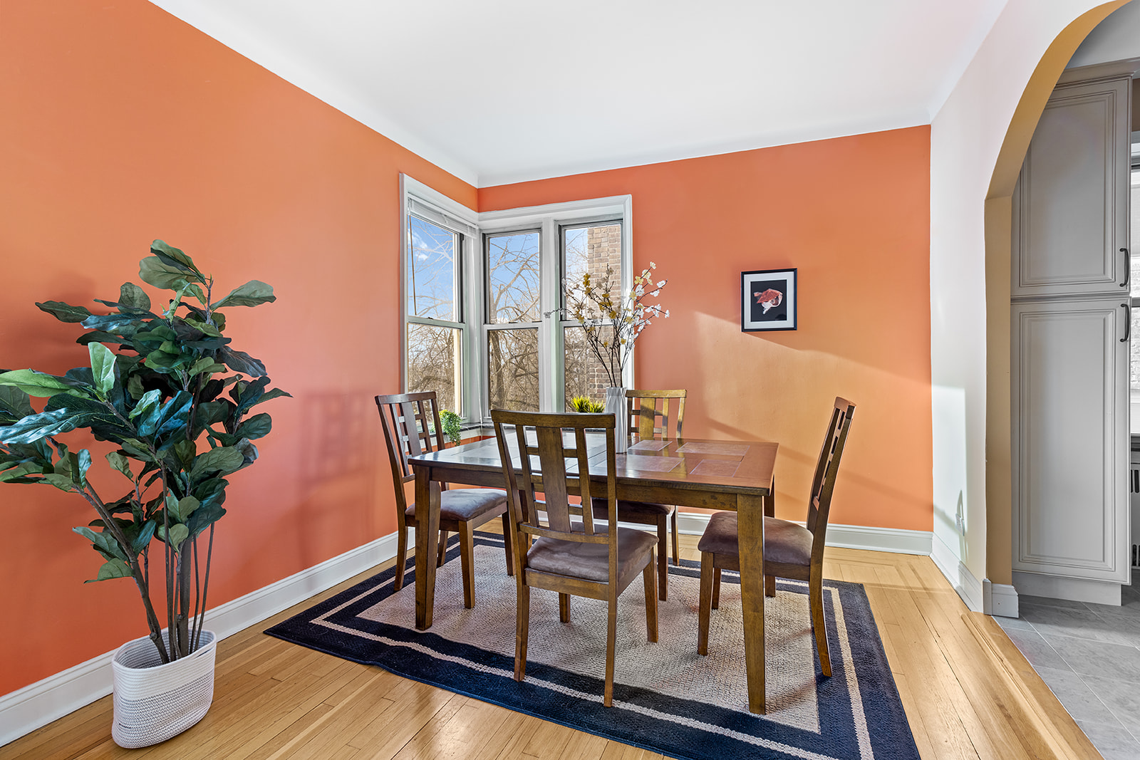 9281 Shore Road, Unit 207 Brooklyn, NY 11209 - Photo 2 of 11 a view of a dining room with furniture window and wooden floor