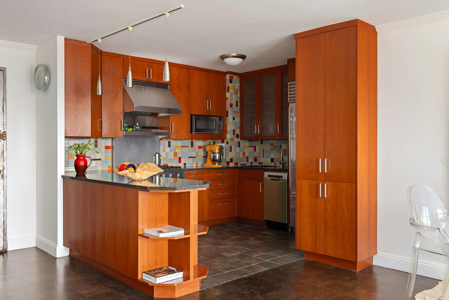 a room with wooden floor and sink