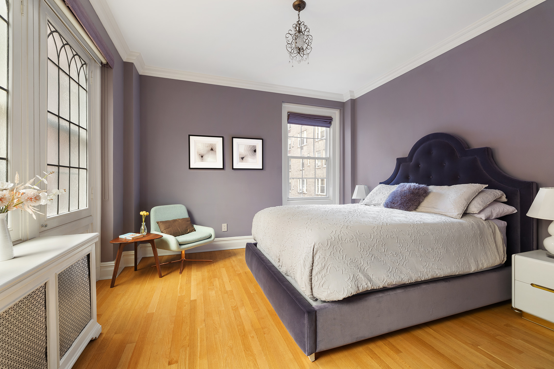 829 Park Avenue, Unit 2D/3D Manhattan, NY 10021 - Photo 11 of 19 a bed sitting in a bedroom next to a window