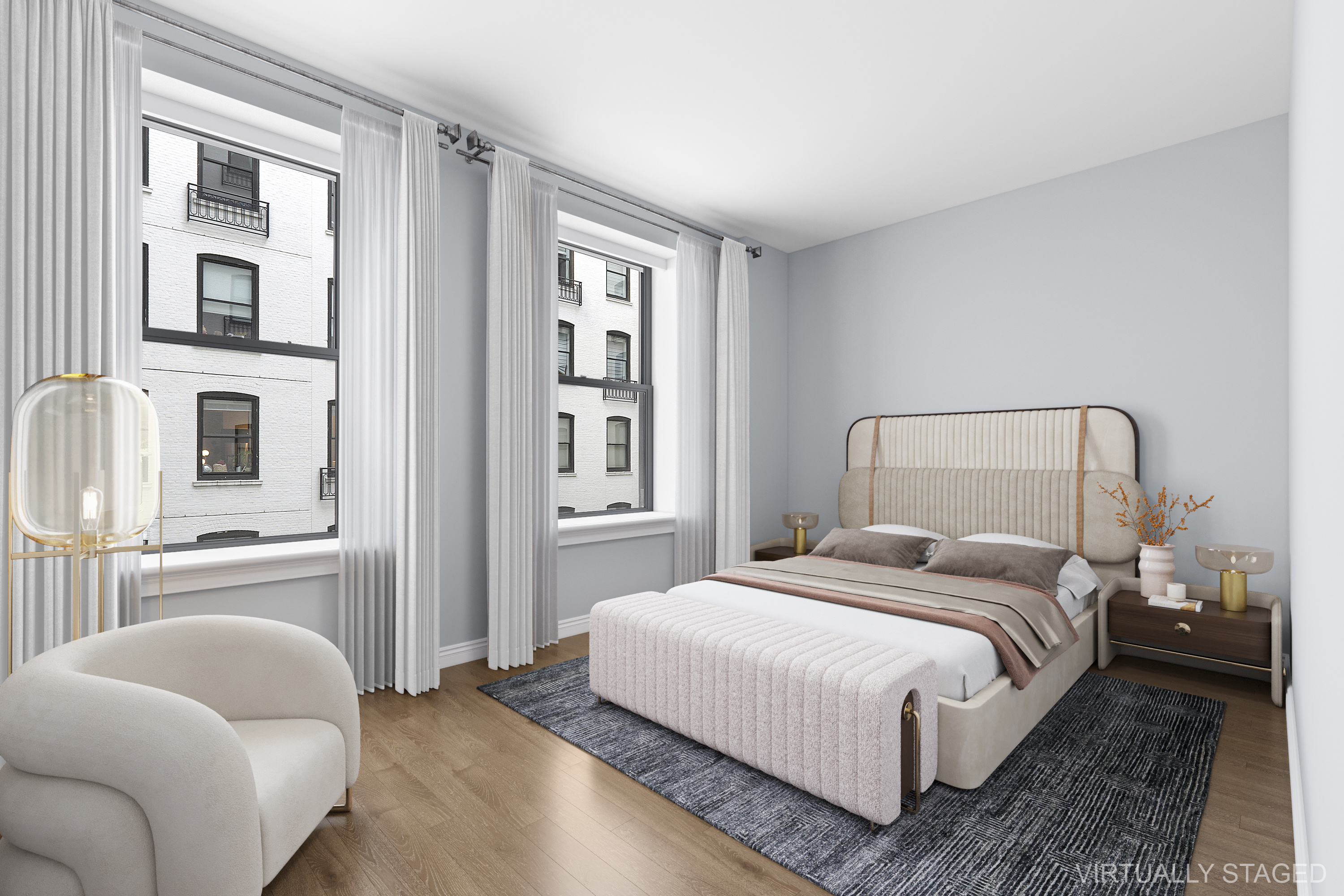 225 5th Avenue, Unit 7K Manhattan, NY 10010 - Photo 7 of 14 a bedroom with a bed and a couch