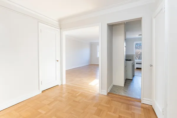 a kitchen with granite countertop a sink stove and refrigerator