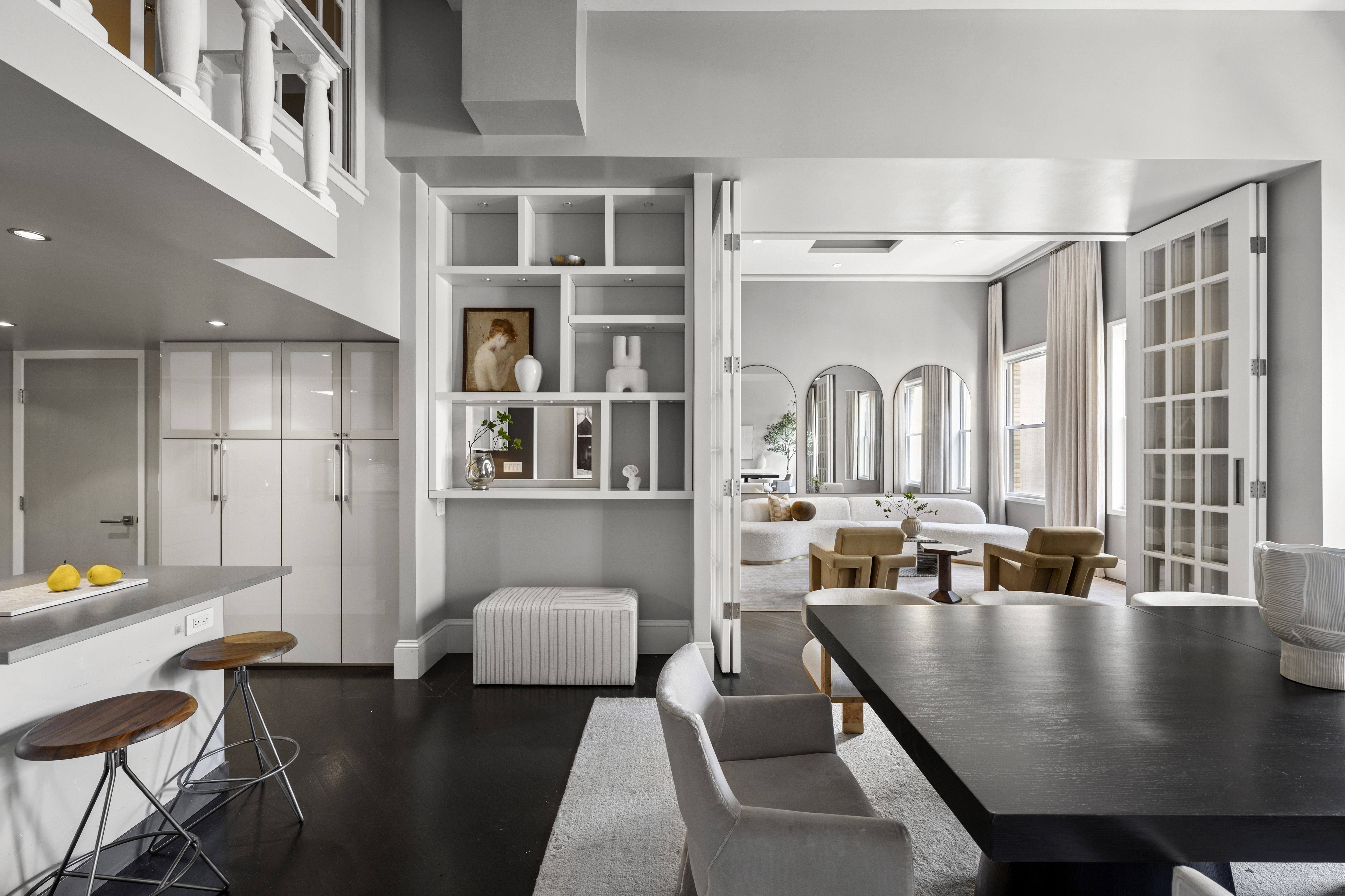 253 West 73rd Street, Unit 6B-C Manhattan, NY 10023 - Photo 5 of 21 a living room with stainless steel appliances granite countertop a couch a table and chairs