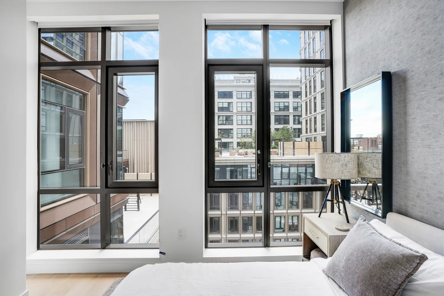 a living room filled with furniture and windows