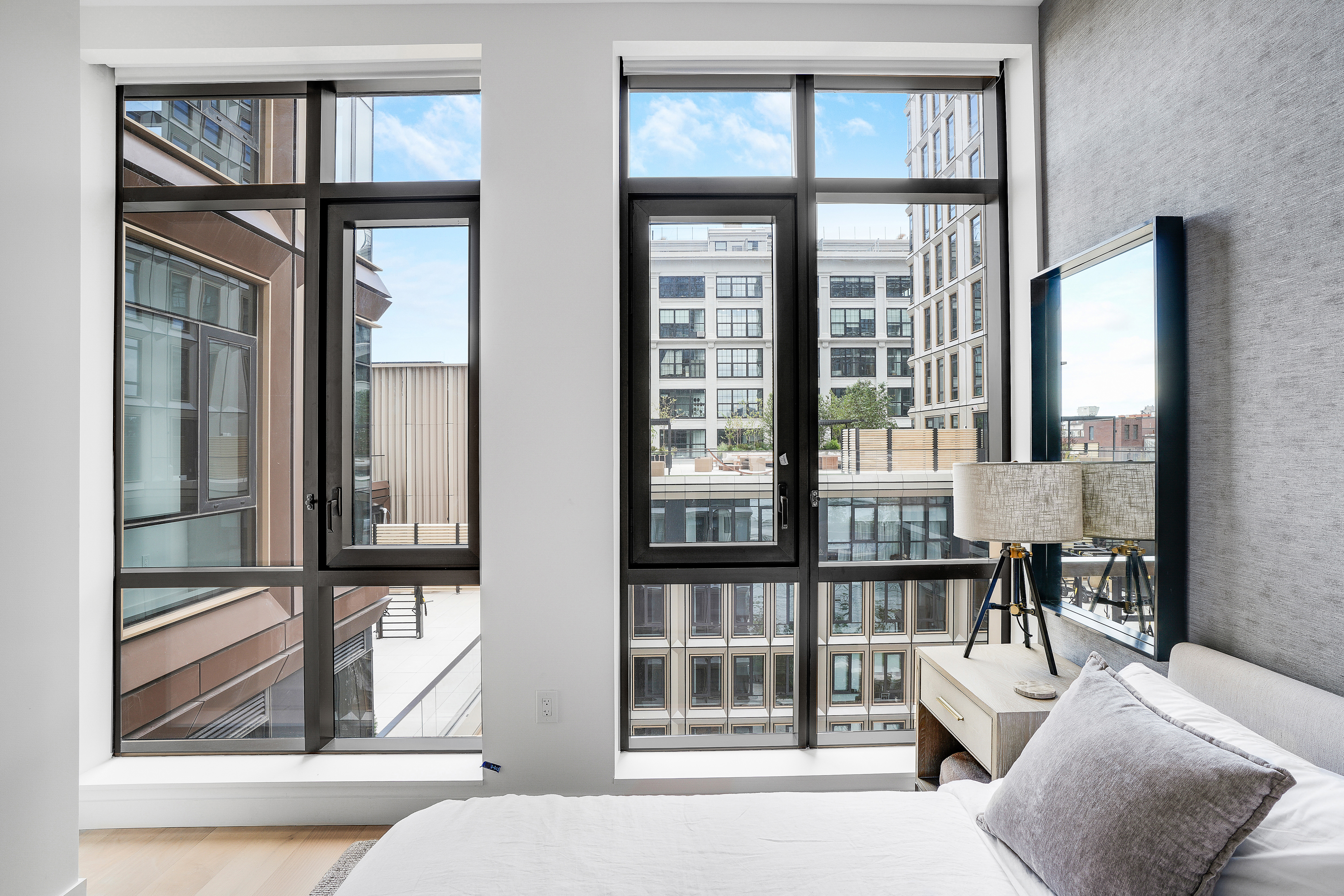 480 Kent Avenue, Unit 9A Brooklyn, NY 11249 - Photo 10 of 33 a living room filled with furniture and windows