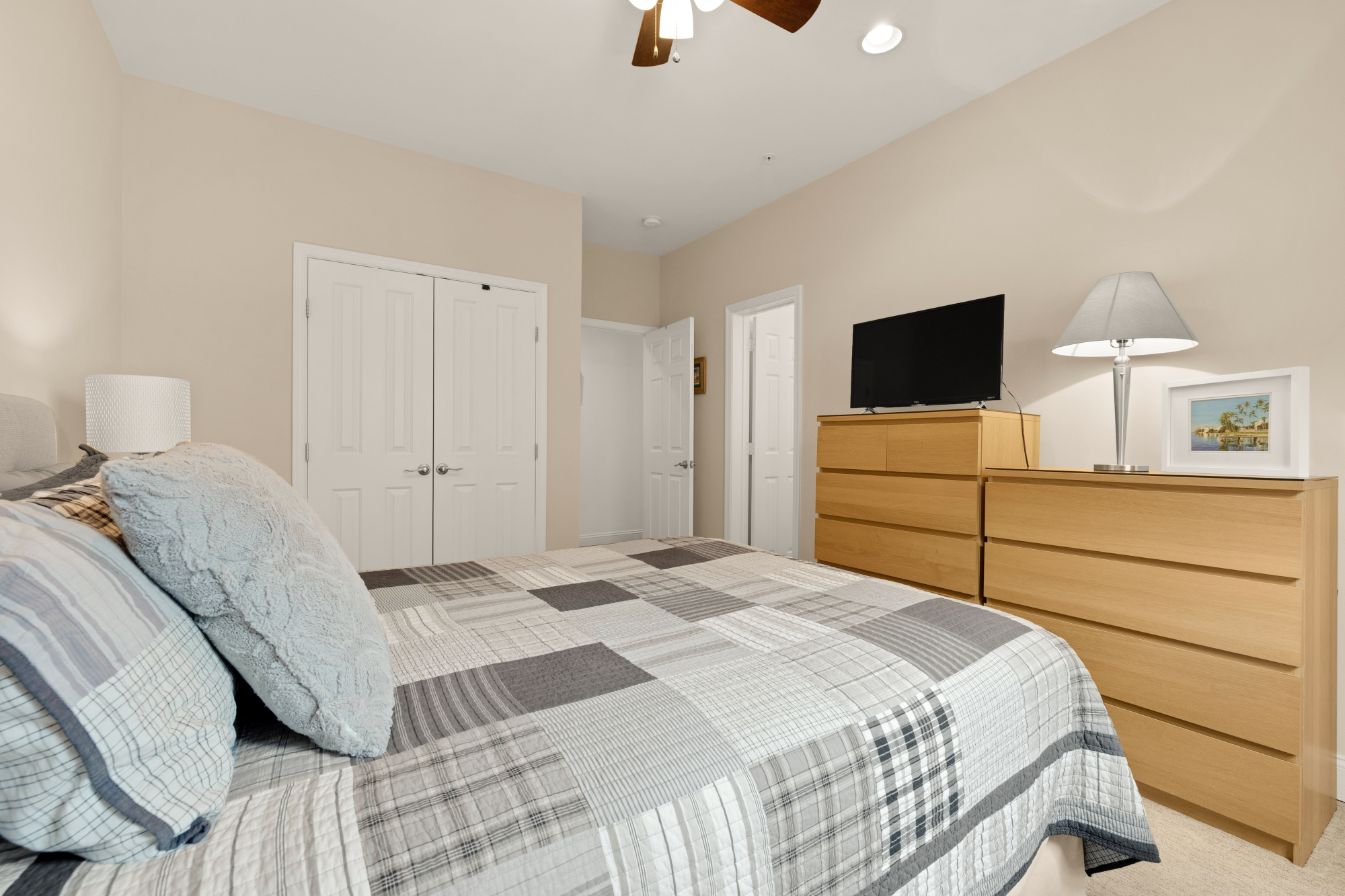 233 S Street Northeast, Unit 4 Washington, DC 20002 - Photo 21 of 37 a bedroom with a bed and a flat tv screen on dresser