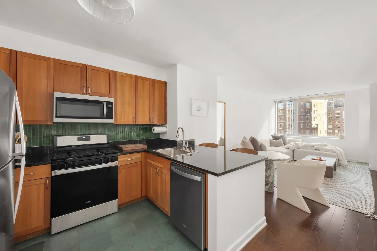 a kitchen with a sink stove and microwave