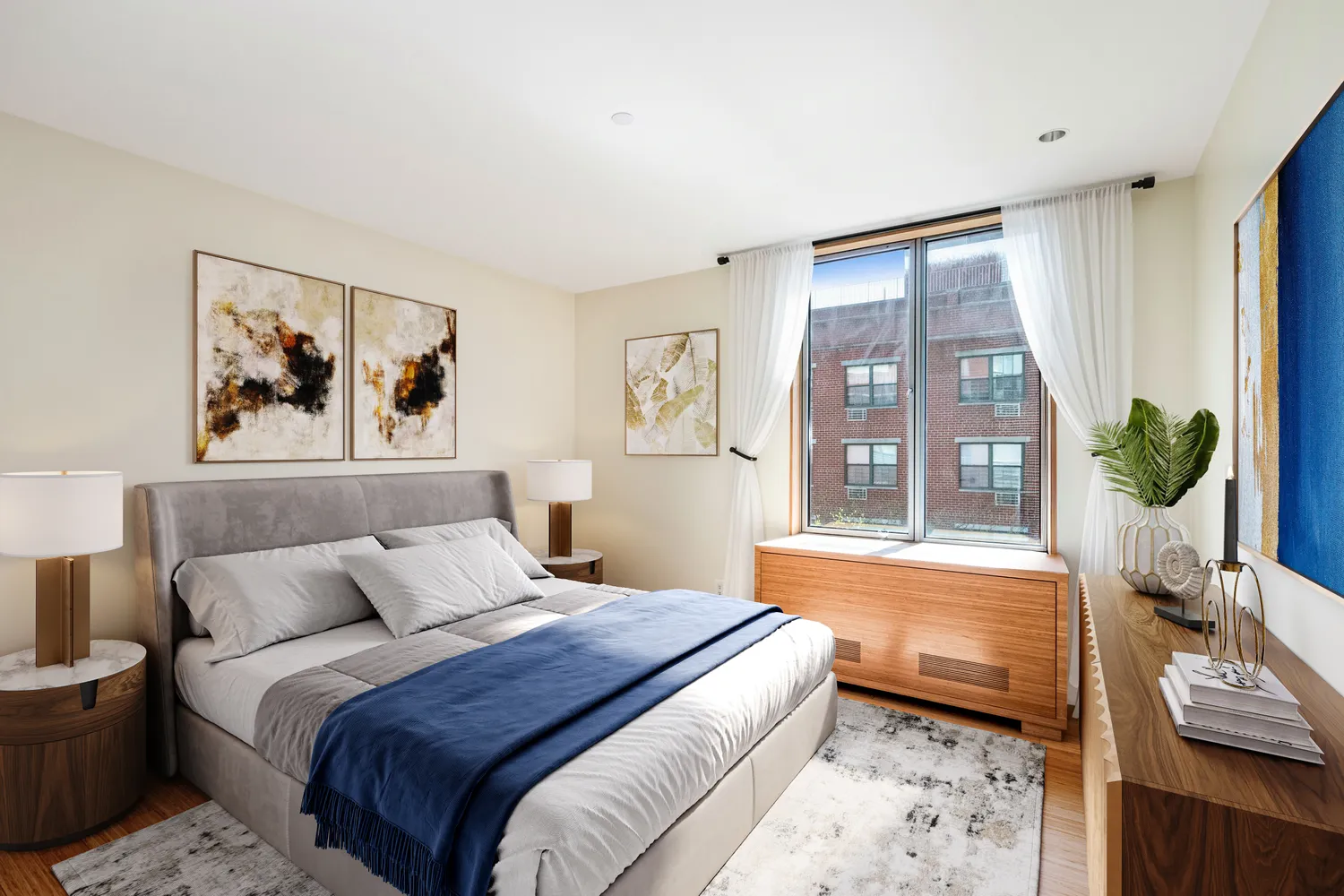 a bed room with a bed a couch and a window