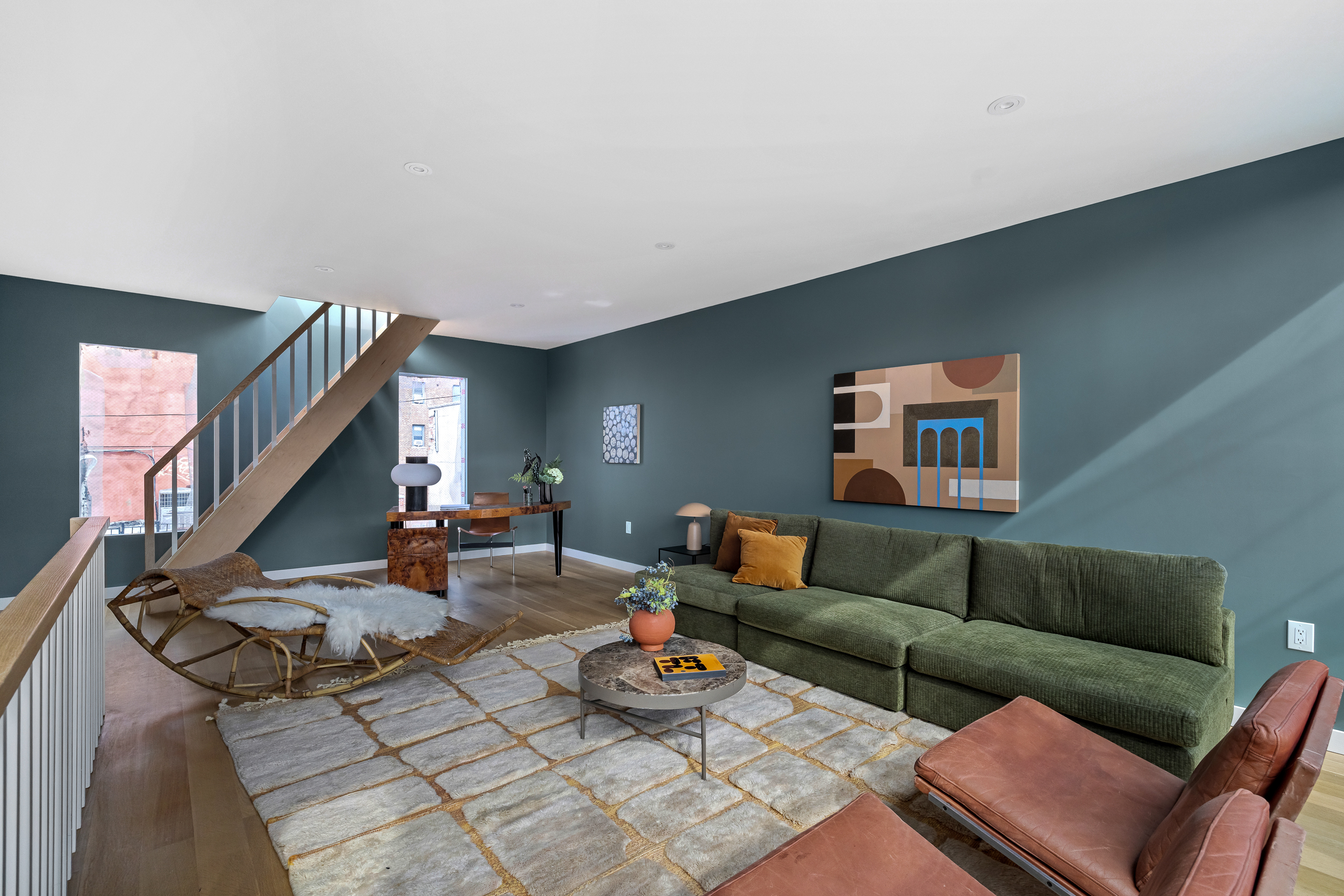 325 Bowery, Unit PH Manhattan, NY 10003 - Photo 13 of 17 a living room with furniture and a wooden floor