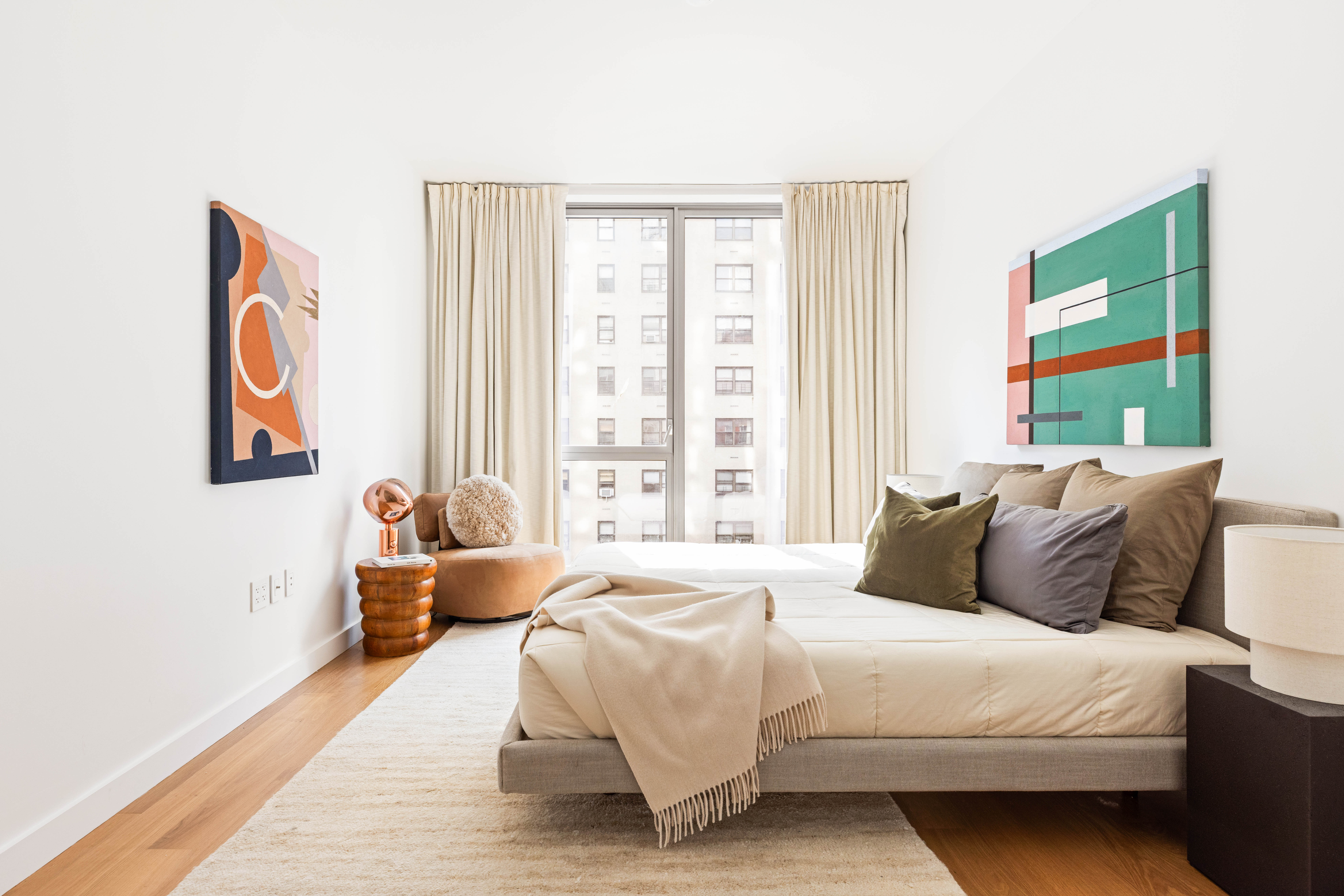 360 East 89th Street, Unit 5D Manhattan, NY 10128 - Photo 7 of 13 a bedroom with a bed and a large window