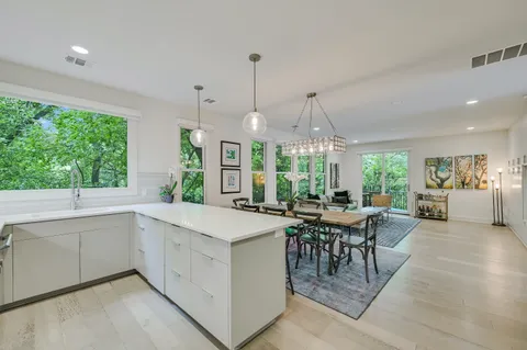 a view of a kitchen and dining room