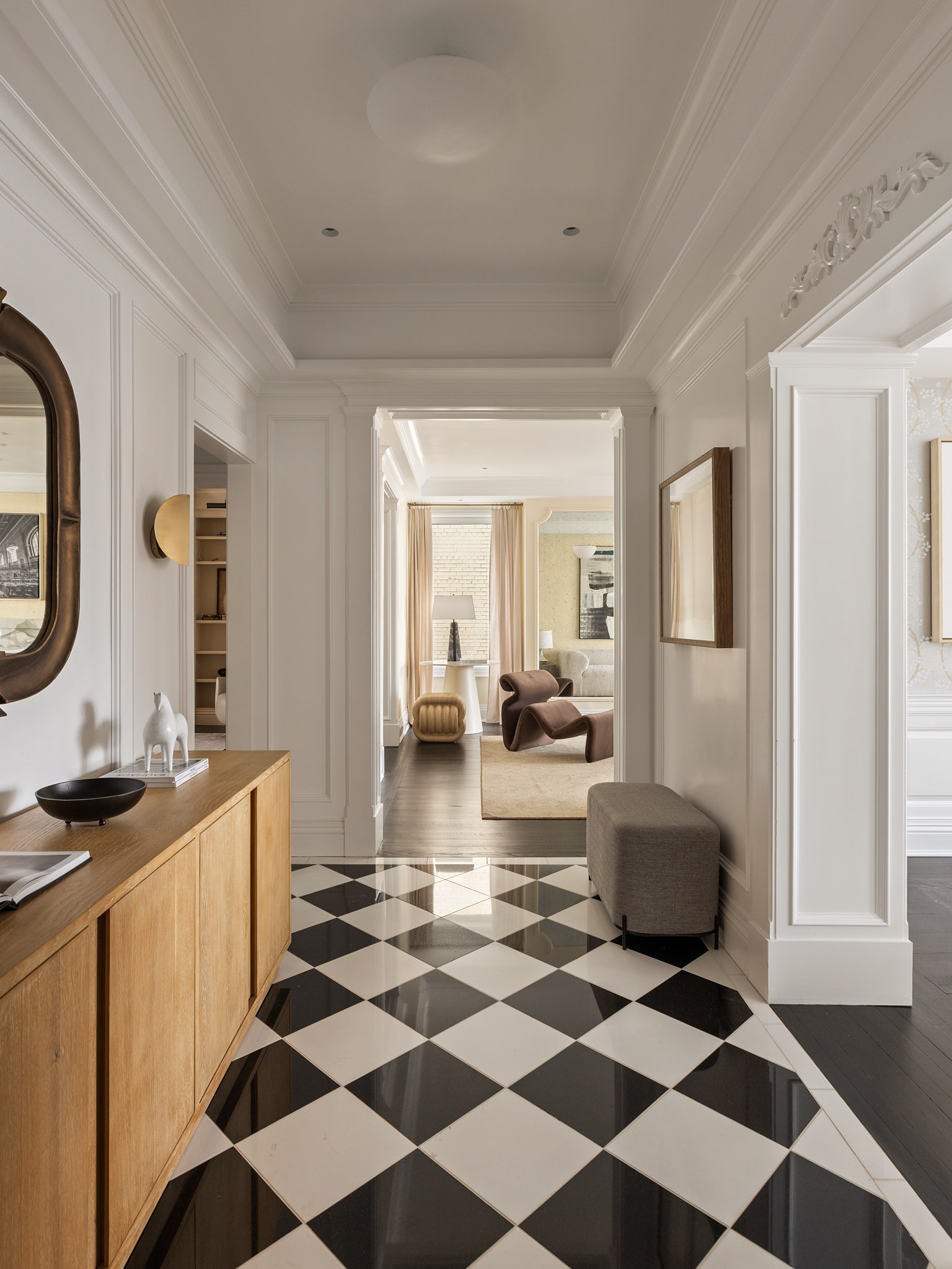 350 East 57th Street, Unit 15B Manhattan, NY 10022 - Photo 8 of 20 a room with a black white checkered floor with a gaming machine and dining chairs