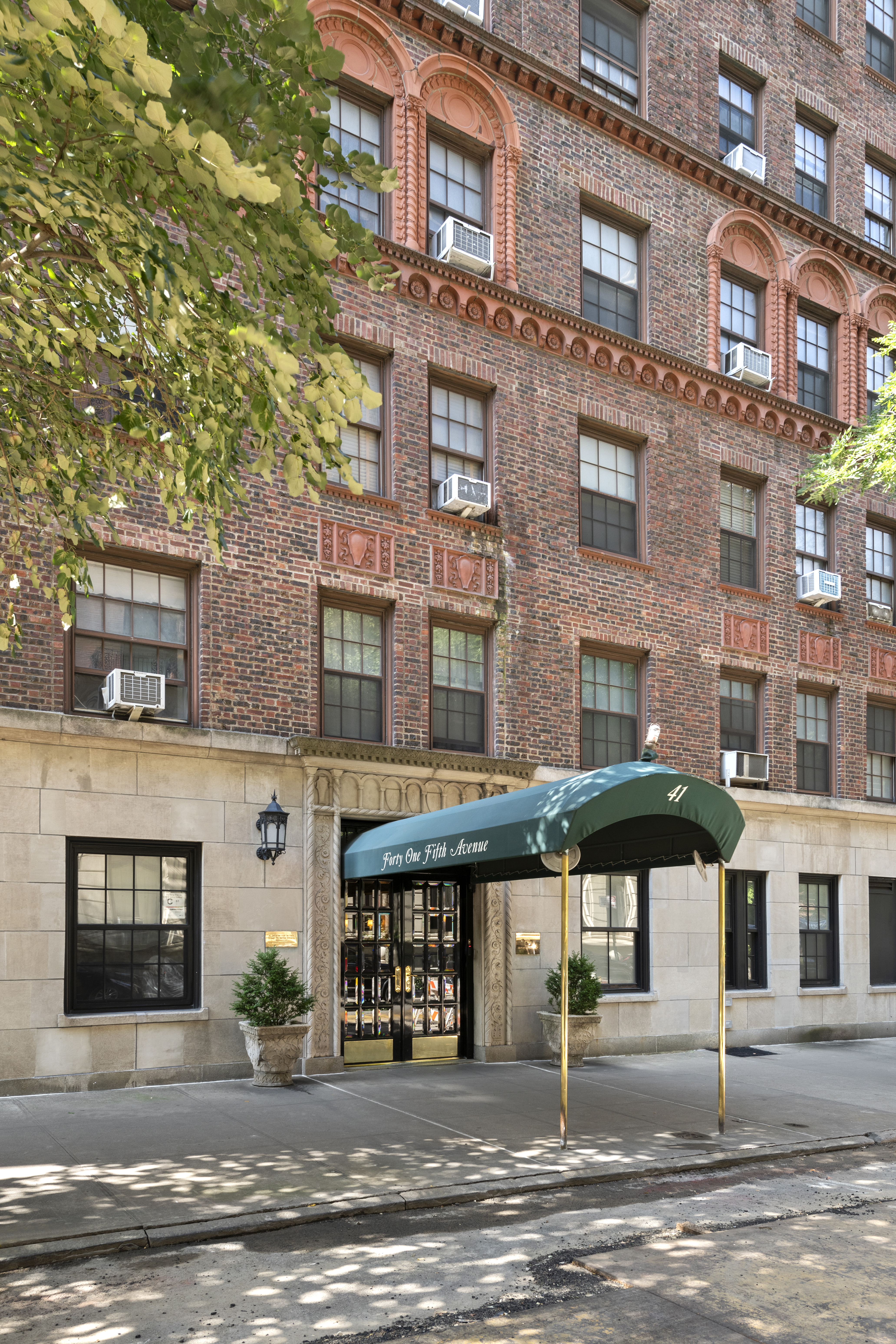 41 5th Avenue, Unit 8CN Manhattan, NY 10003 - Photo 10 of 11 a front view of a building with street