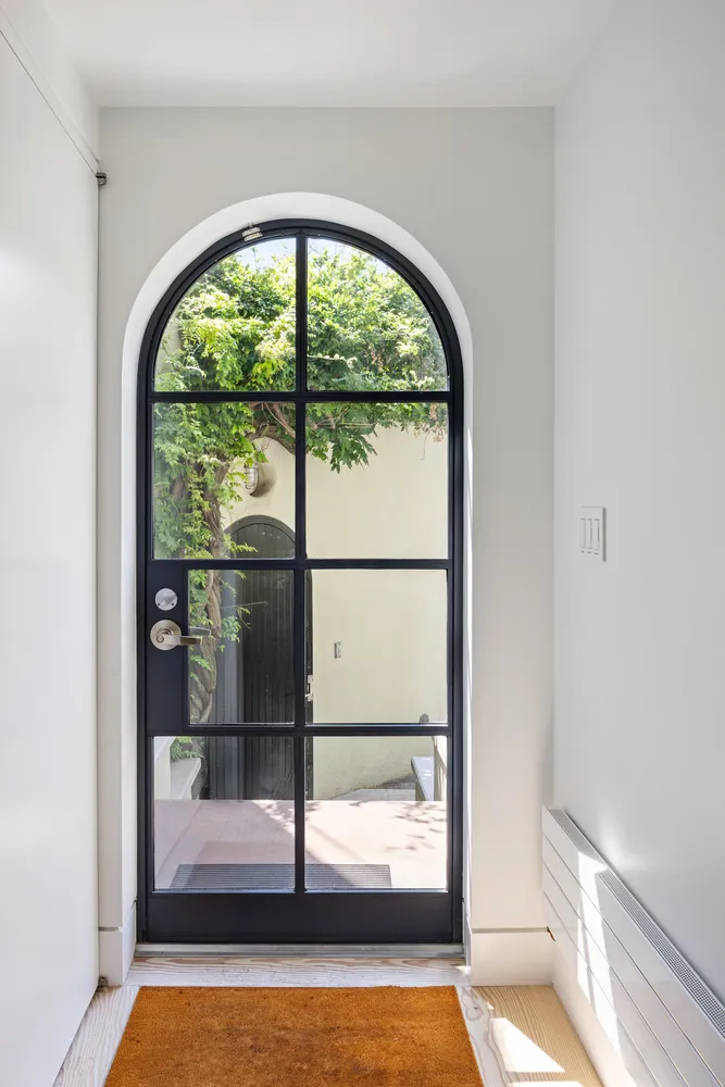 a view of empty room with floor to ceiling window