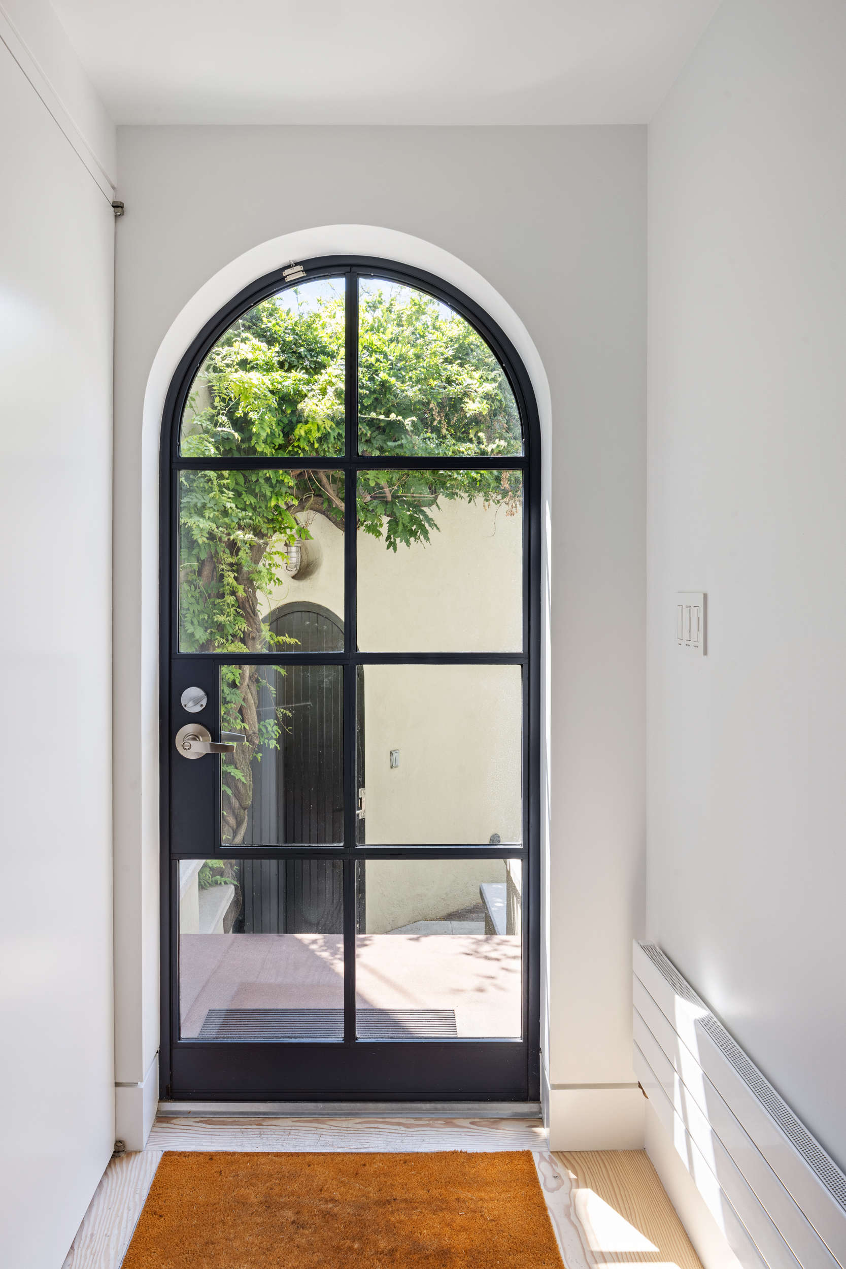 39 Barrow Street Manhattan, NY 10014 - Photo 17 of 39 a view of empty room with floor to ceiling window