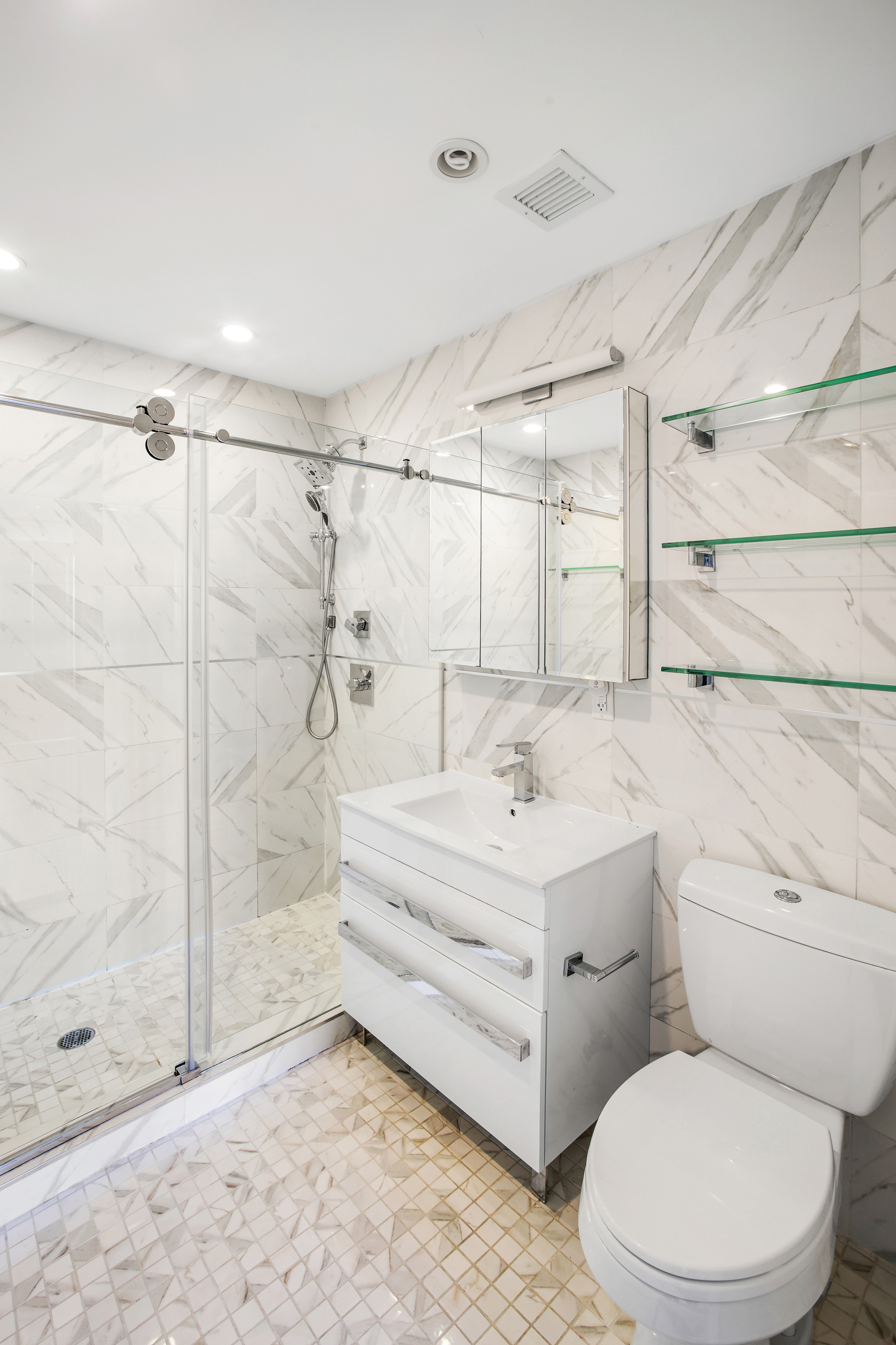 3041 Ocean Avenue, Unit PH4 Brooklyn, NY 11235 - Photo 10 of 18 a bathroom with a sink toilet and shower