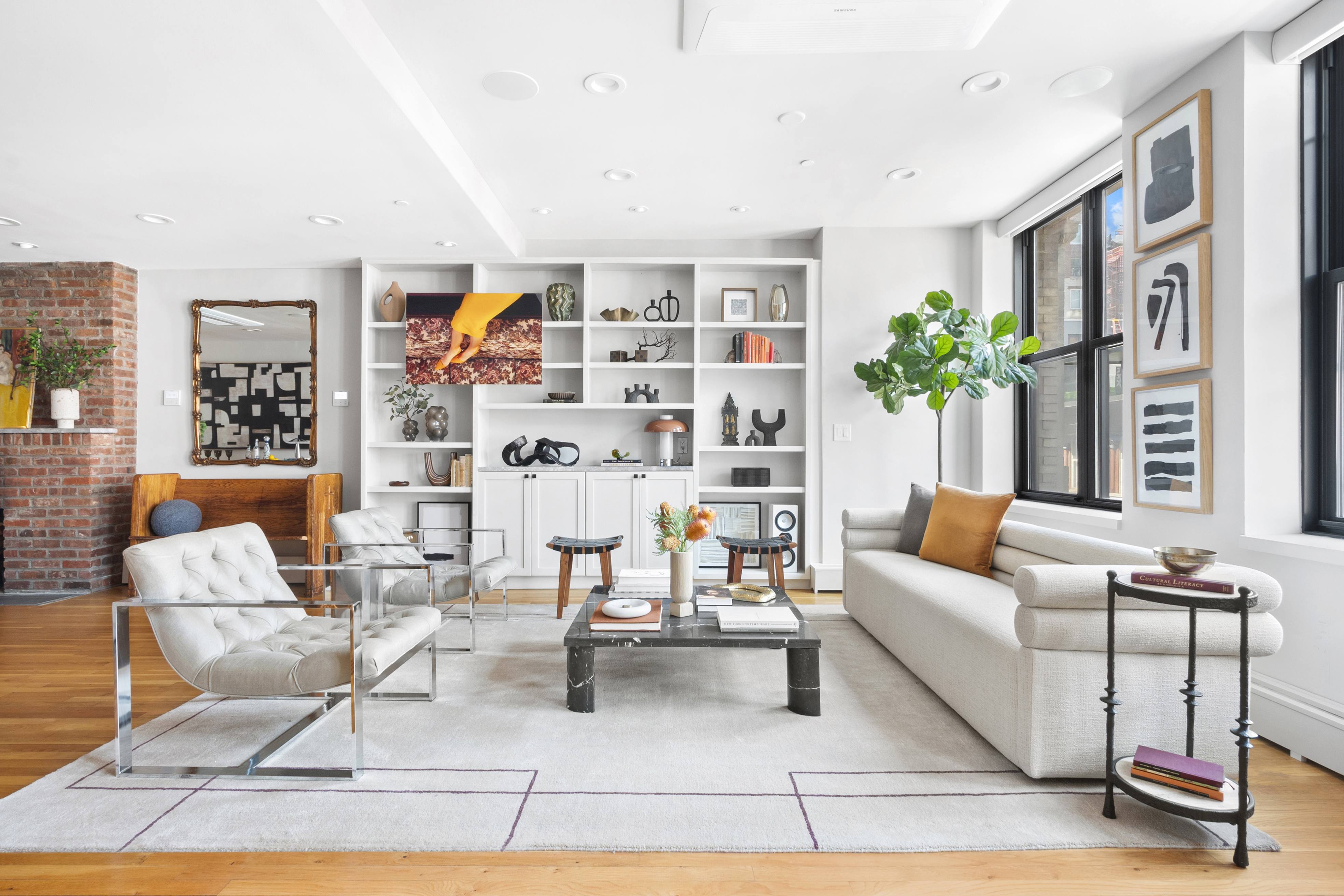 120 West 20th Street, Unit PH Manhattan, NY 10011 - Photo 3 of 15 a living room with furniture and a potted plant