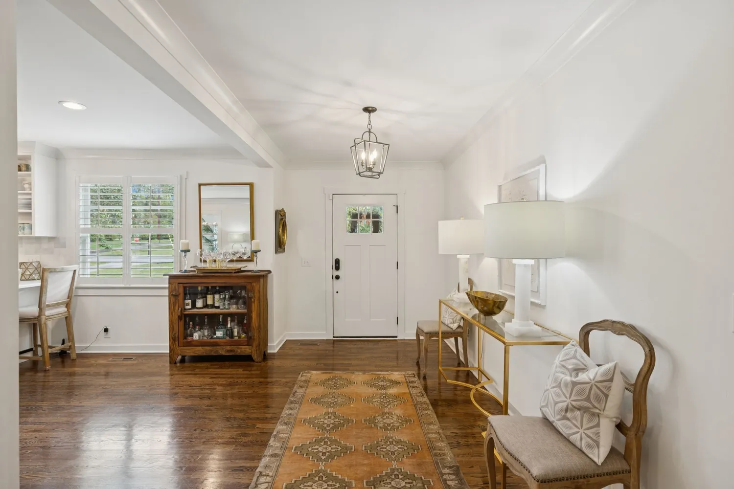 a living room with furniture fireplace and a piano