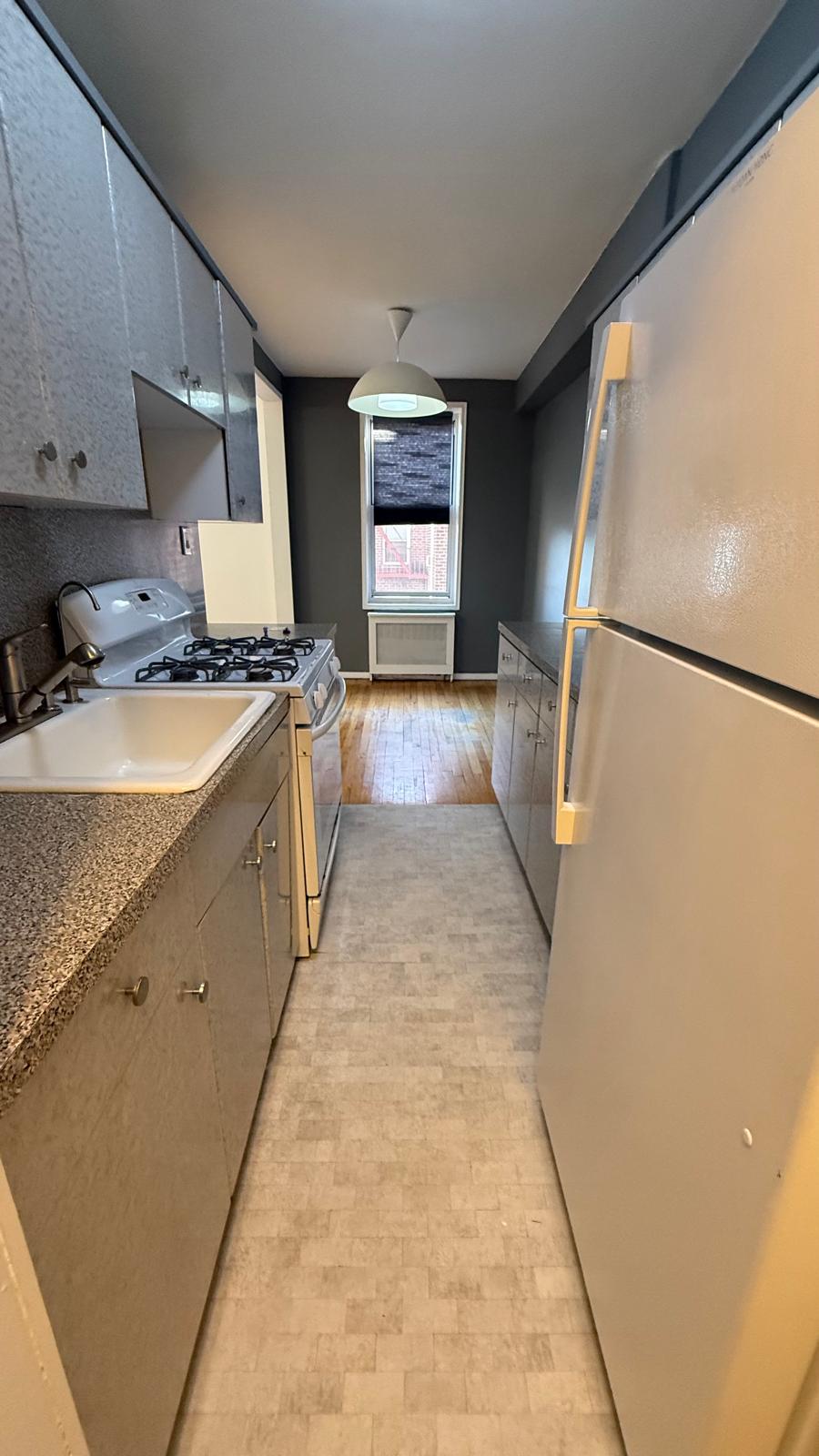 2665 Homecrest Avenue, Unit 4ZC Brooklyn, NY 11235 - Photo 4 of 9 a kitchen with stainless steel appliances granite countertop a refrigerator a stove and a sink