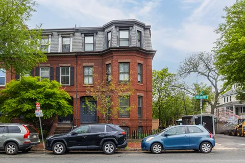 a car parked in front of a house