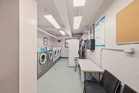 a view of a storage & utility room with washer and dryer