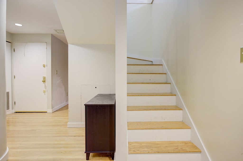 327 Commonwealth Avenue Boston, MA 02115 - Photo 25 of 26 a view of staircase with white walls and white walls