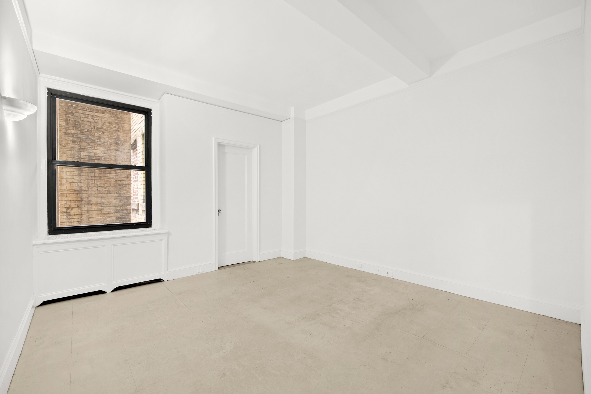 55 East 72nd Street, Unit 2NORTH Manhattan, NY 10021 - Photo 11 of 18 an empty room with windows