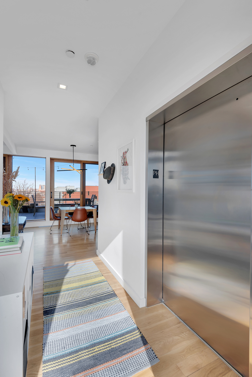 267 Evergreen Avenue, Unit PH Brooklyn, NY 11221 - Photo 6 of 19 a gym with kitchen island