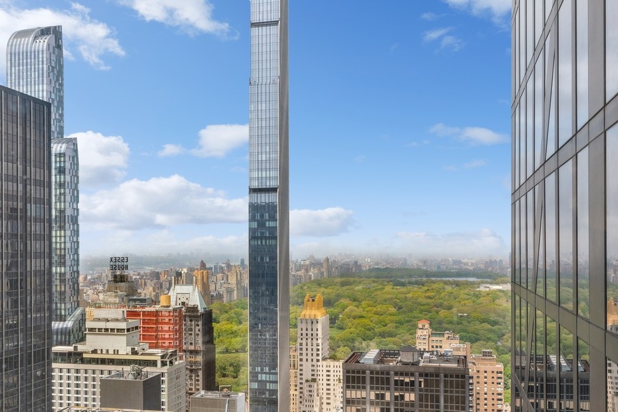 53 West 53rd Street, Unit 52B Manhattan, NY 10019 - Photo 2 of 15 a city view with tall buildings