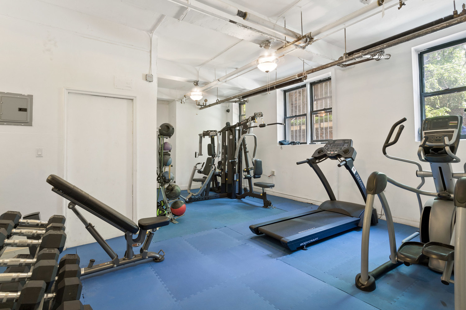 305 West 18th Street, Unit 2F Manhattan, NY 10011 - Photo 8 of 10 a view of a room with gym equipment