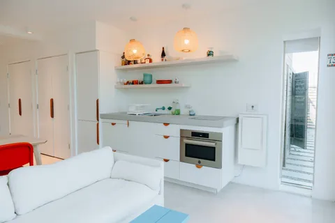 a bedroom with a bed and a couch