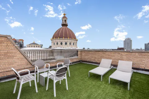 a view of a patio with a yard