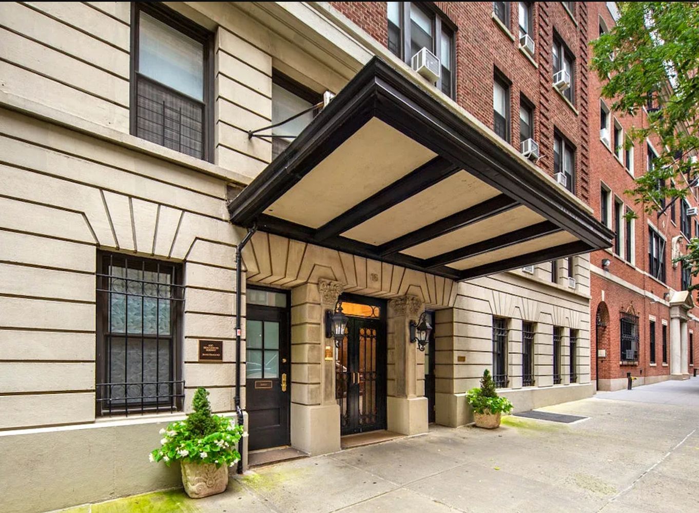 16 East 98th Street, Unit 8D Manhattan, NY 10029 - Photo 8 of 11 a front view of a building