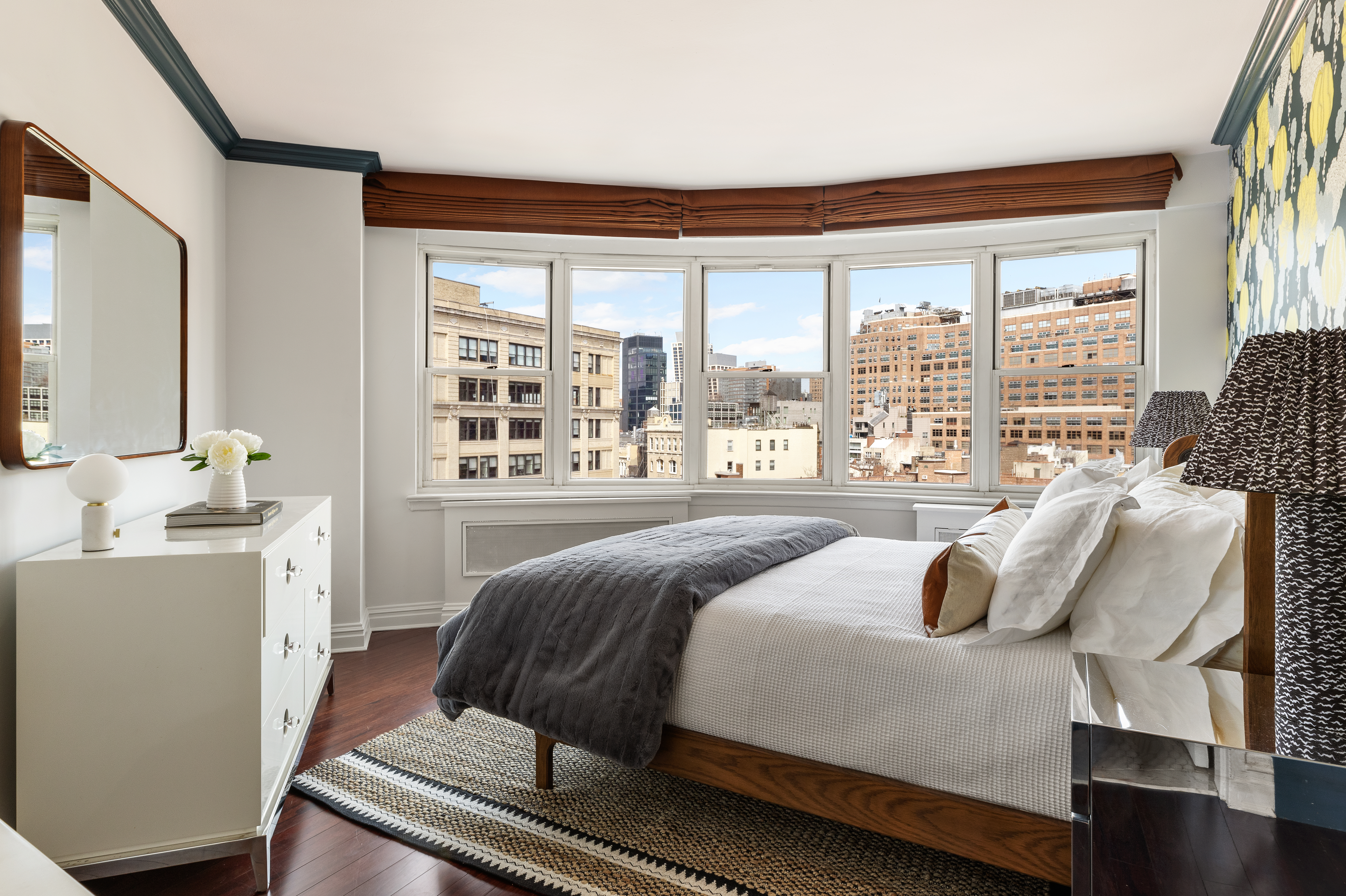 14 Horatio Street, Unit 11F Manhattan, NY 10014 - Photo 7 of 16 a bedroom with a bed and wooden floor