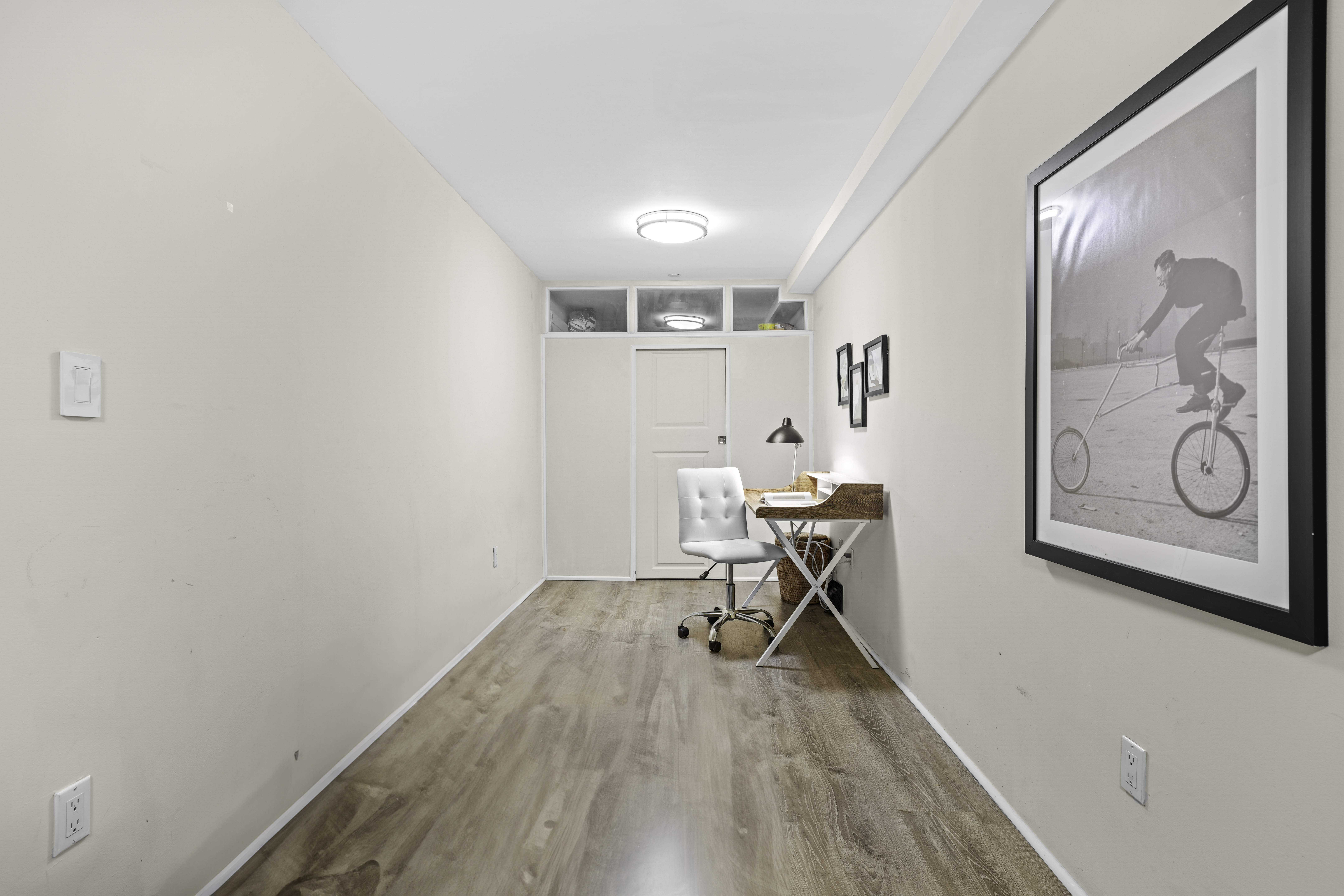 714 St Nicholas Avenue, Unit 1 Manhattan, NY 10031 - Photo 10 of 18 a workspace with furniture and wooden floor