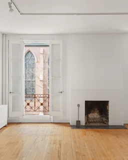 a view of a door with wooden floor