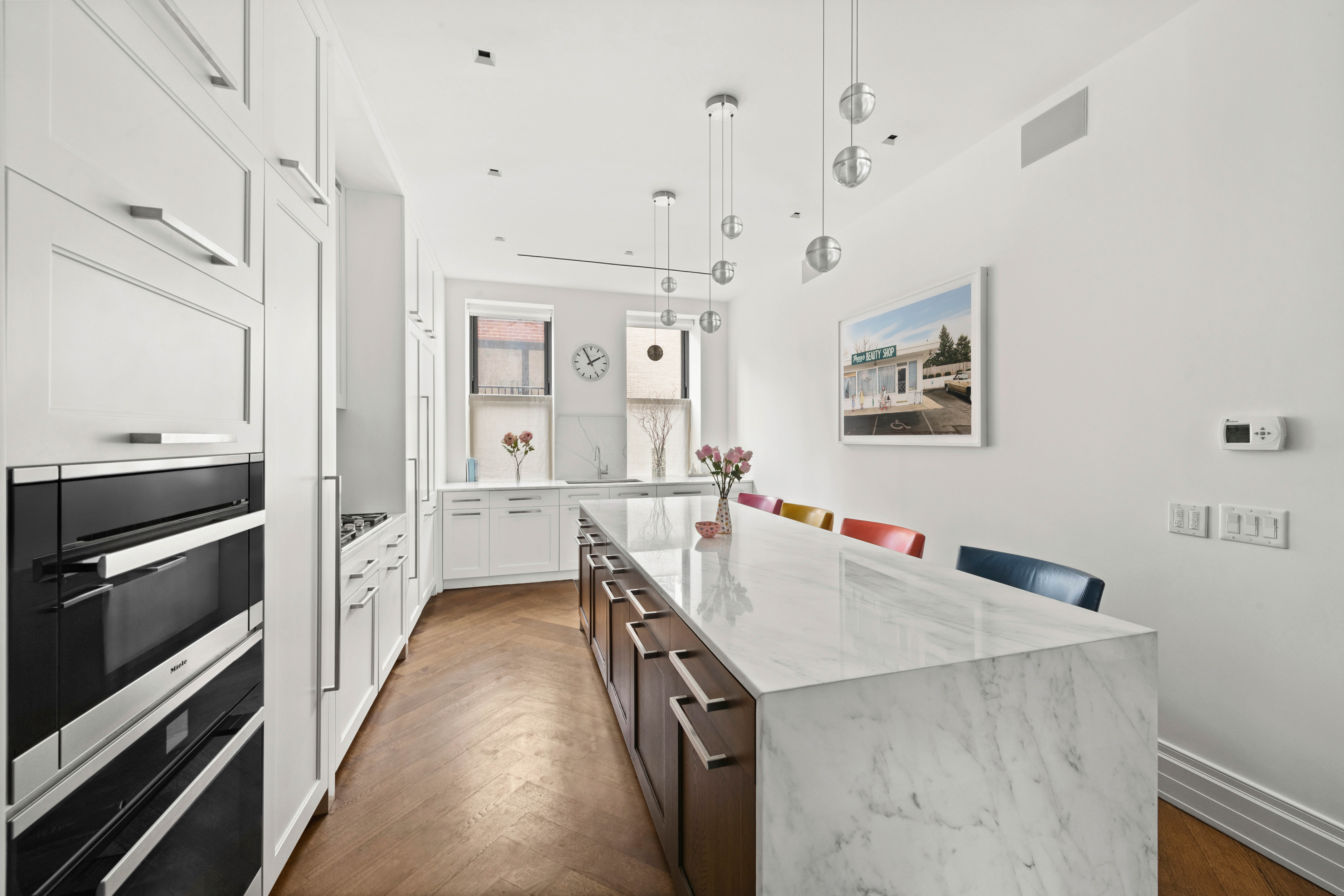 a kitchen with a stove a refrigerator and a sink