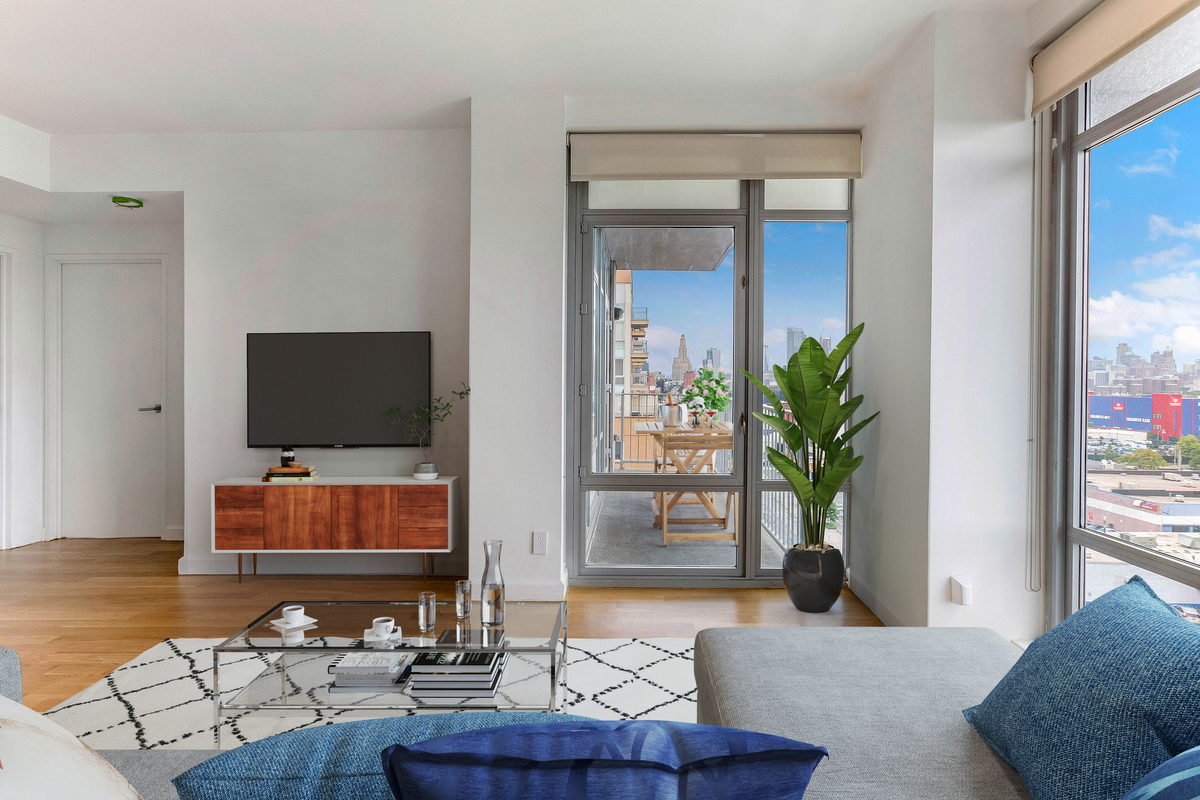 267 6th Street, Unit PHNW Brooklyn, NY 11215 - Photo 3 of 17 a living room with furniture and a flat screen tv