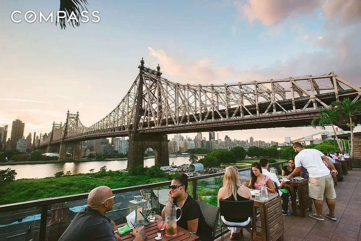 a front view of a house with garden and patio