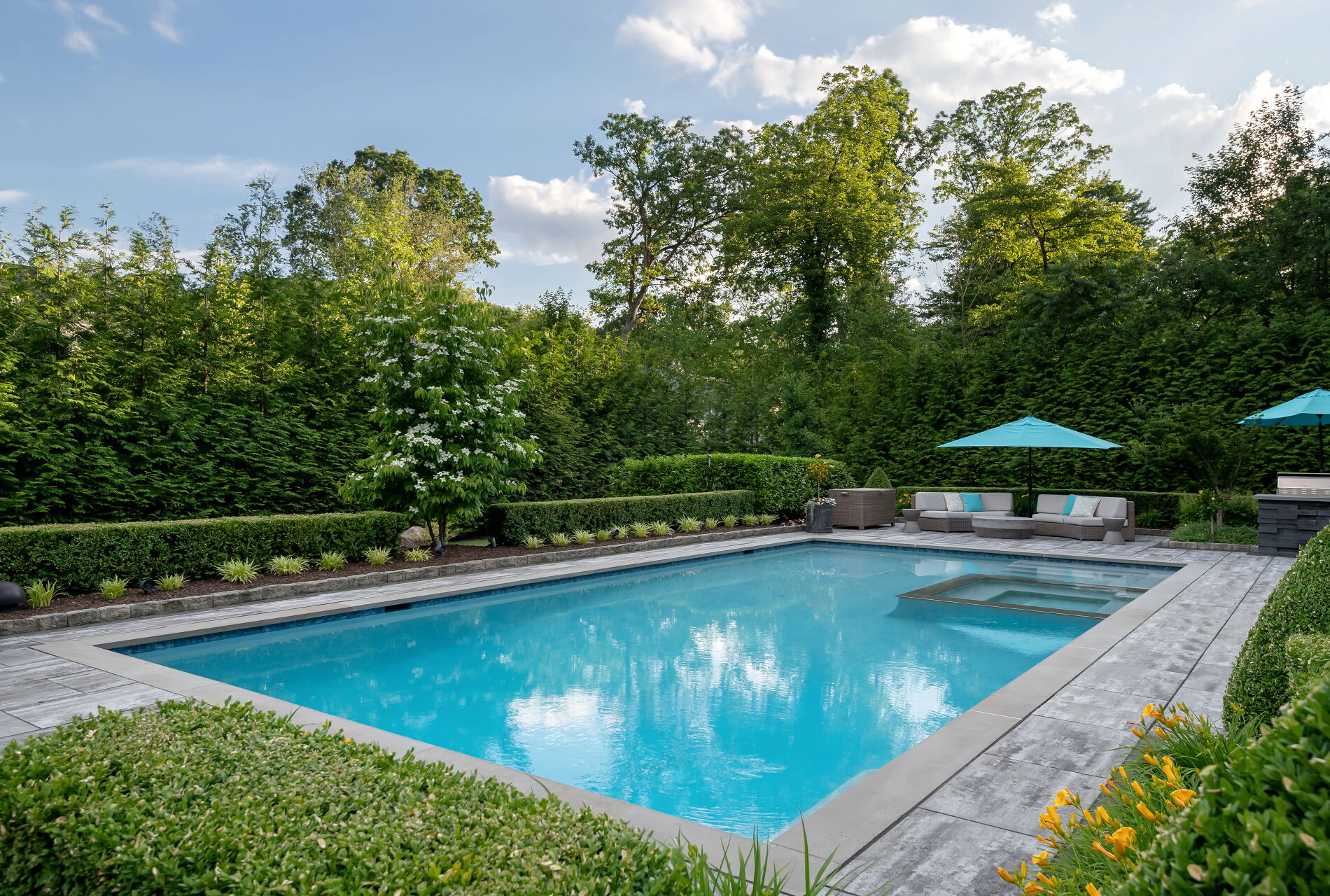 838 Seneca Road Franklin Lakes, NJ 07417 - Photo 66 of 92 a view of a swimming pool with a bench and trees in the background