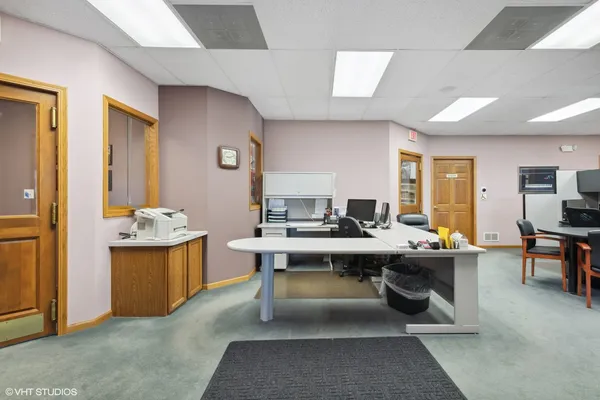 a view of a workspace with furniture