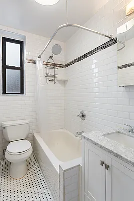 Riverside Dr W, Unit 6H Manhattan, NY 10032 - Photo 5 of 6 a bathroom with a sink a toilet and shower