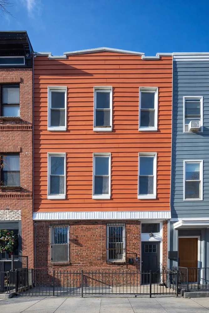 a front view of a building with many windows