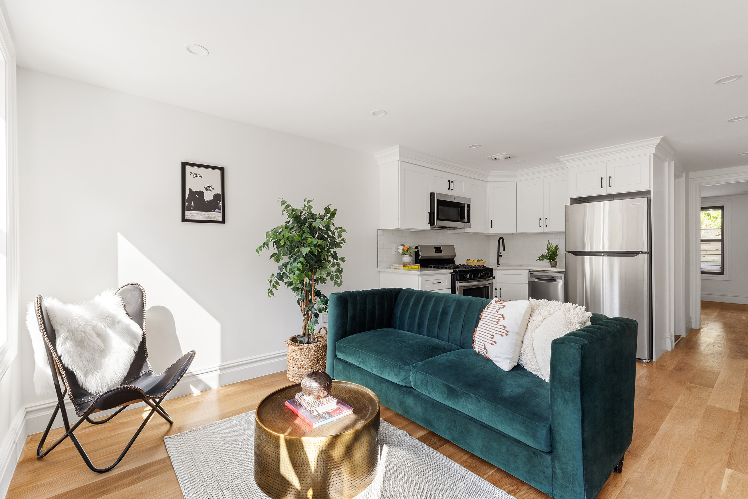 749 Monroe Street Brooklyn, NY 11221 - Photo 10 of 14 a living room with furniture and a dining table with kitchen view