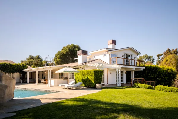 a view of a balcony with chairs
