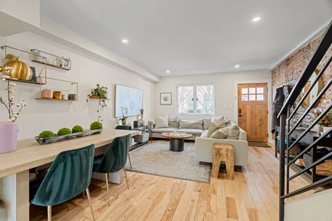 a dining room with wooden floor and breakfast area