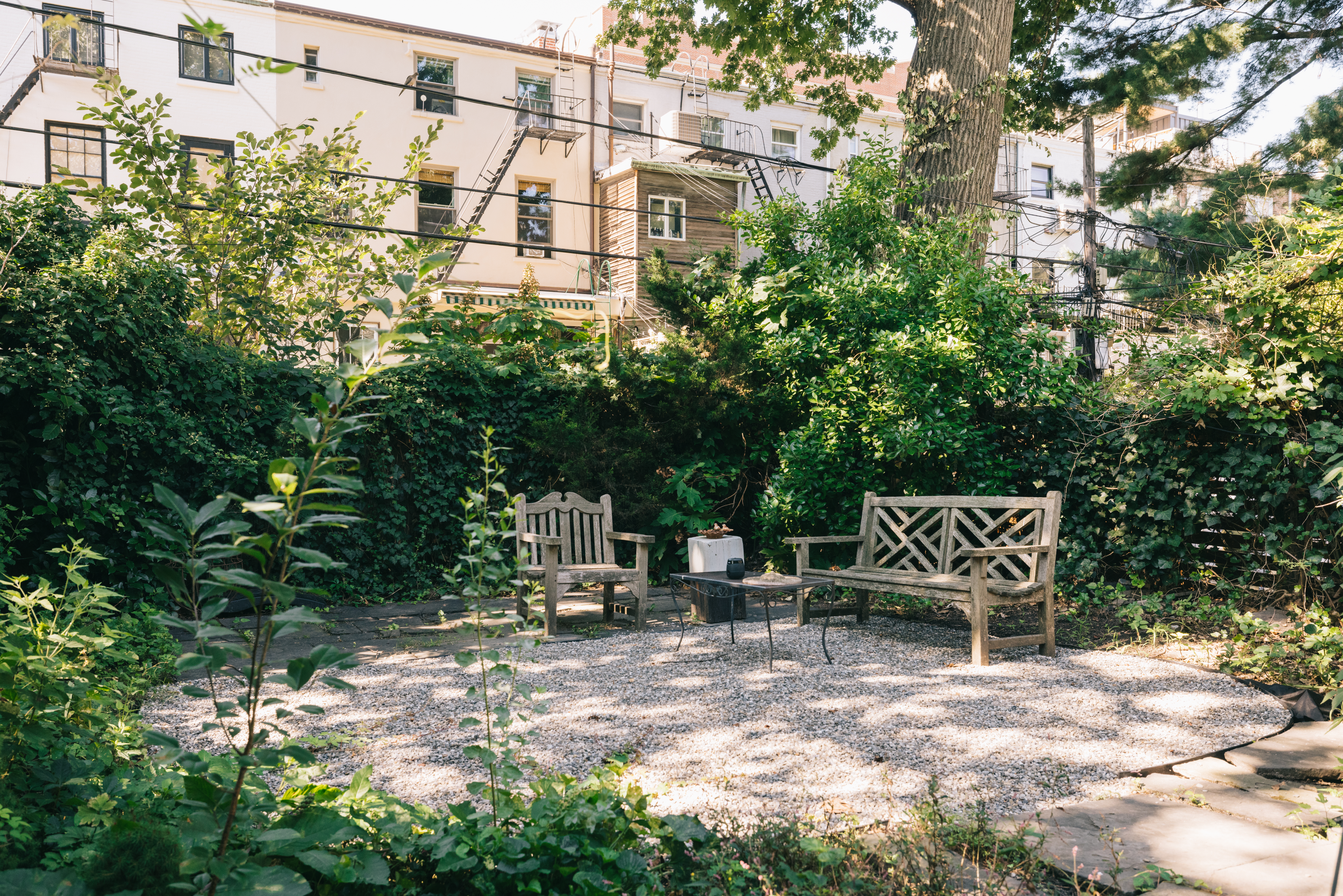 188 Warren Street, Unit TRIPLEX Brooklyn, NY 11201 - Photo 13 of 15 a view of bench sitting in backyard of house