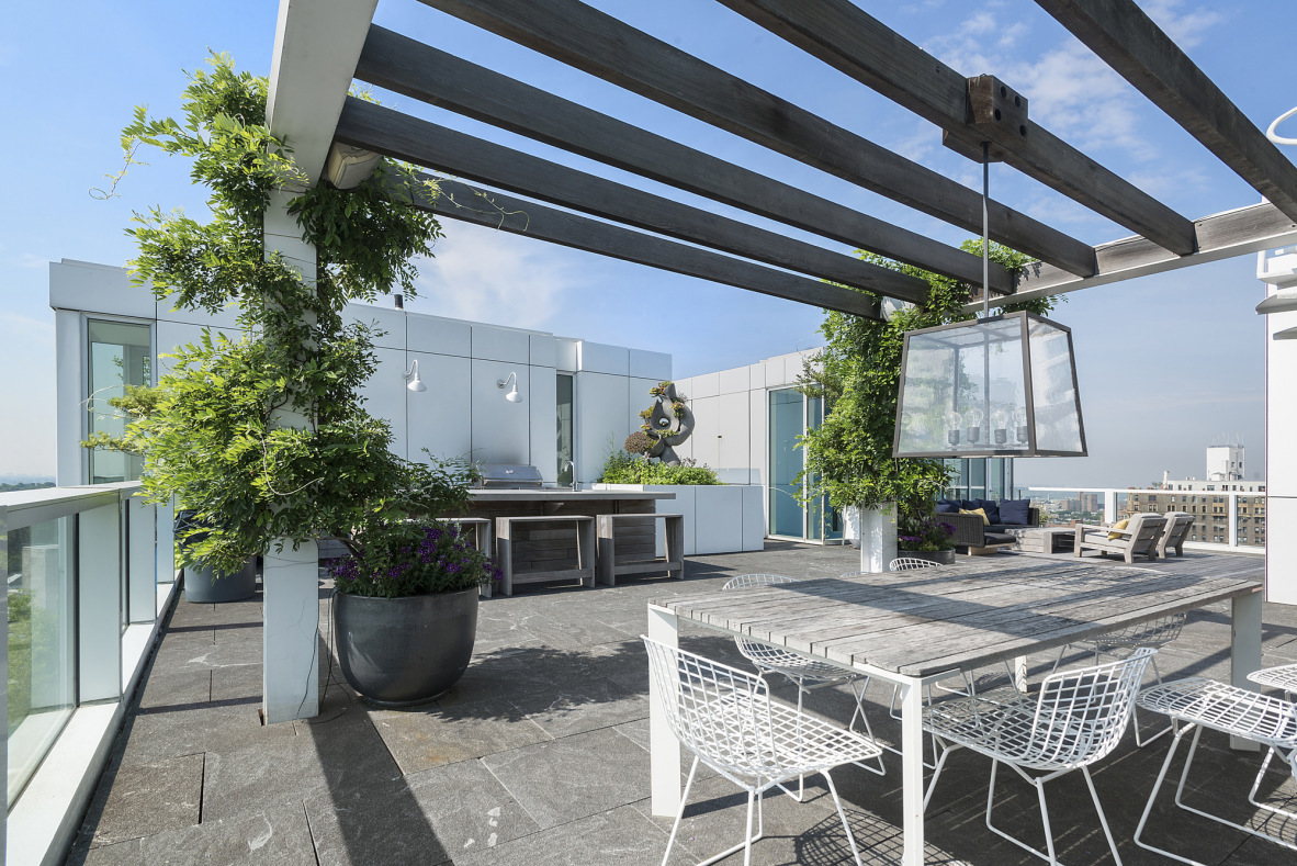 1 Grand Army Plaza, Unit 5C Brooklyn, NY 11238 - Photo 15 of 17 a patio with a table and chairs and potted plants