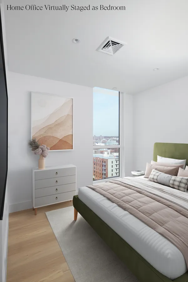 a bedroom with a bed and window