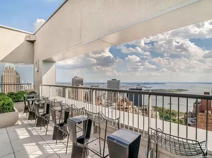 a view of a balcony with chairs