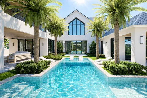 a view of house with yard and swimming pool